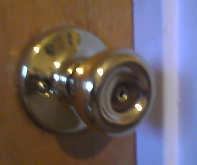 unlocking door knob with hole photo - 2